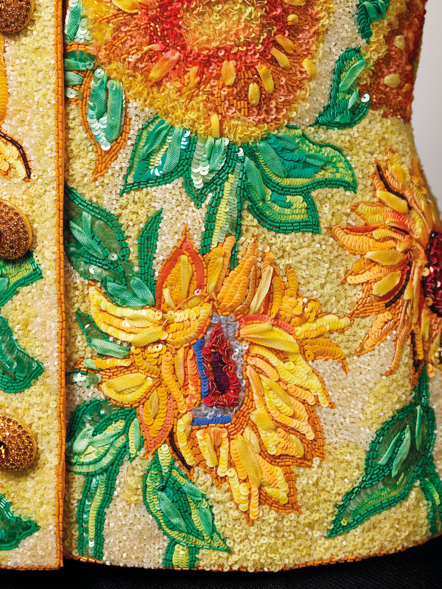 Yves Saint Laurent haute couture Spring-Summer 1988. An exceptional ‘Sunflowers’ jacket embroidered by Lesage, with green silk skirt. In tribute to Vincent Van Gogh. 27 November 2019 at Christie’s in Paris