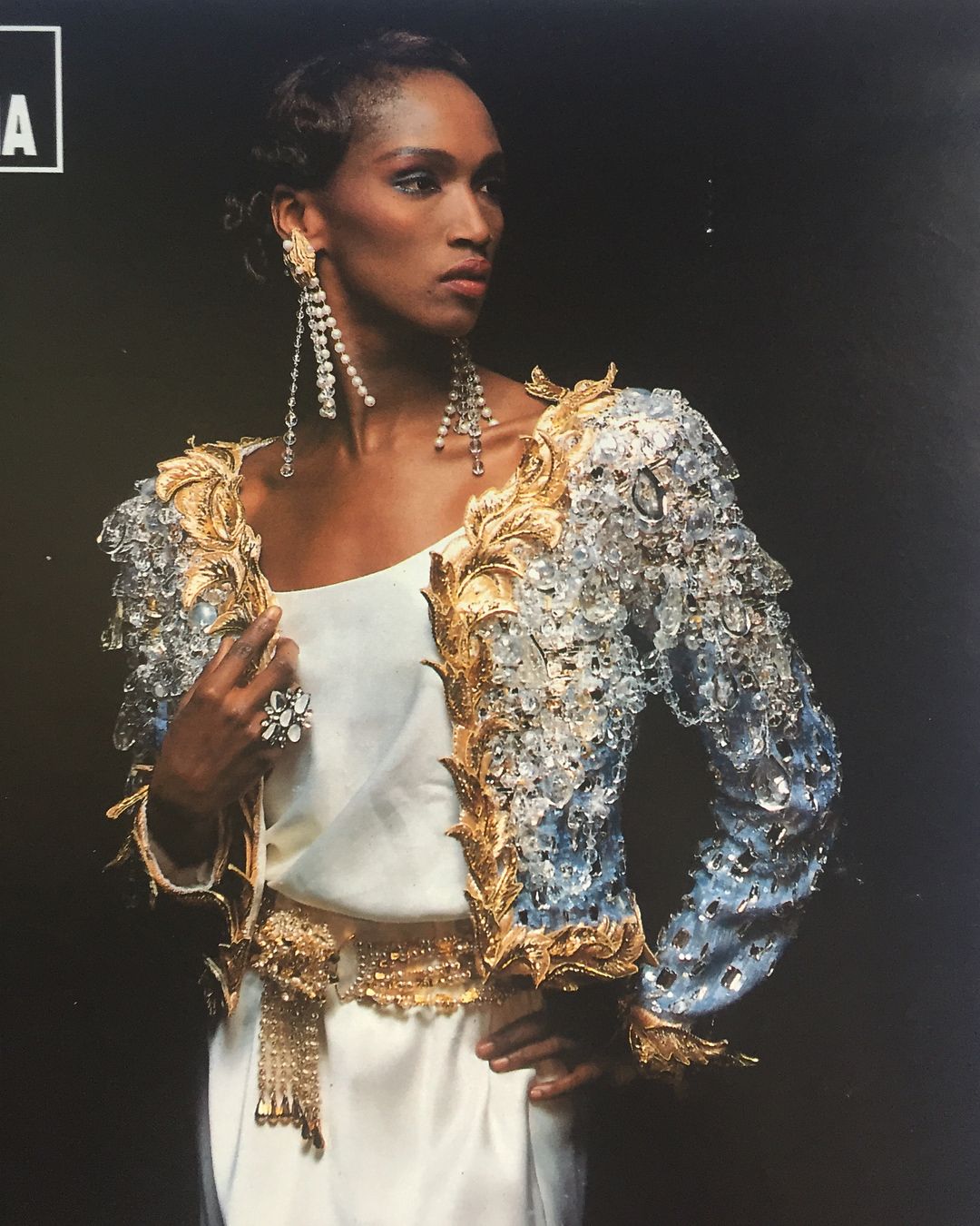 Legendary model, beauty and activist Katoucha Niane in Yves Saint Laurent's "Hommage à ma Maison" evening jacket, embroidered by Lesage. Photo by Adria in ¡Hola! magazine's Spring/Summer 1990 fashion especial