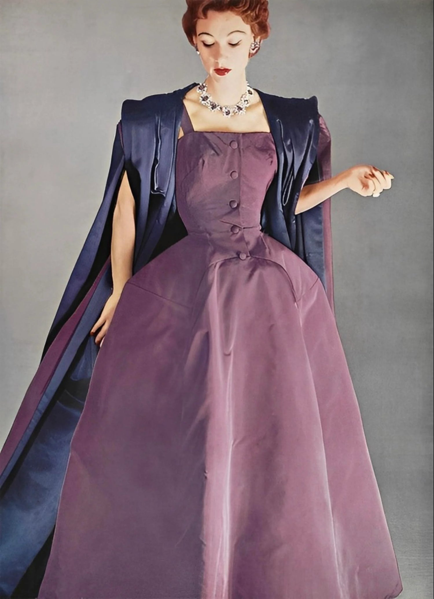 Christian Dior Haute Couture Collection, Fall-Winter 1952-53. Sophie Malgat wears a mauve faux-cut evening dress by Bianchini Ferier. Photo Philippe Pottier.