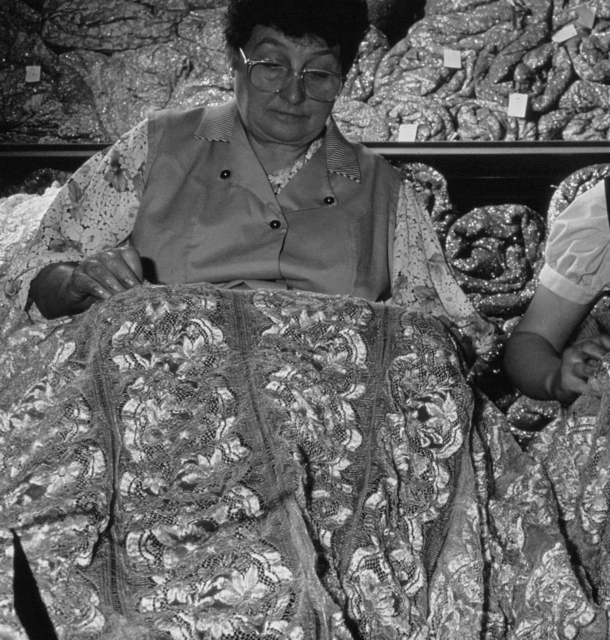 Workers checking lace after coming out of the loom, Marescot, Calais. (Photo by Pool HAITMAN/TREAL/Gamma-Rapho via Getty Images)